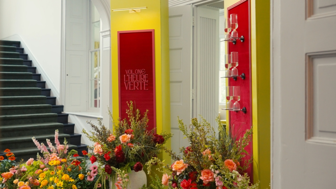 Saturated floral installation and red architectural detail at The Highlands Mansion